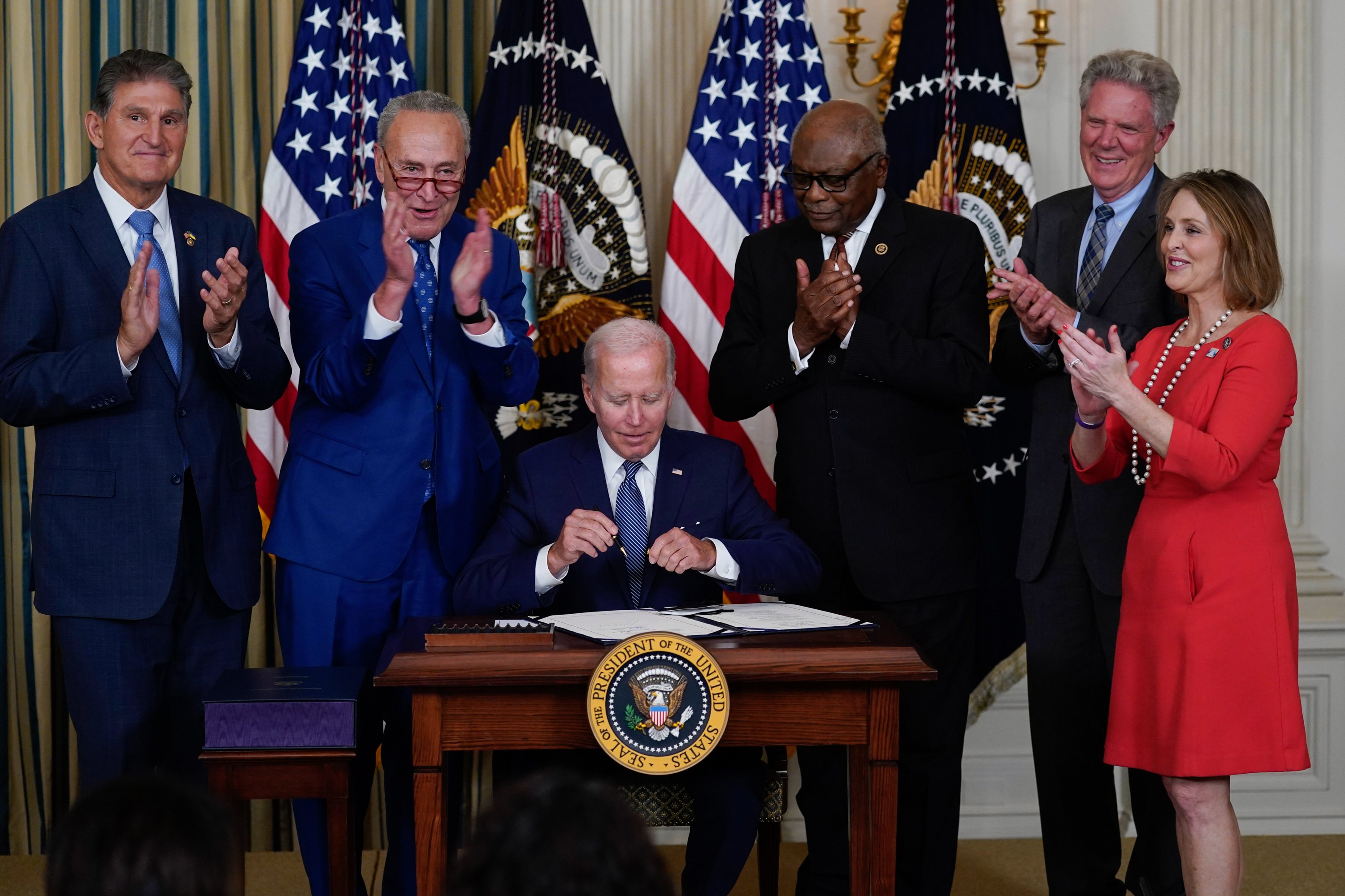 President Joe Biden signs the Inflation Reduction Act in the State Dining Room of the White House. President Joe Biden signs the Inflation Reduction Act in the State Dining Room of the White House.