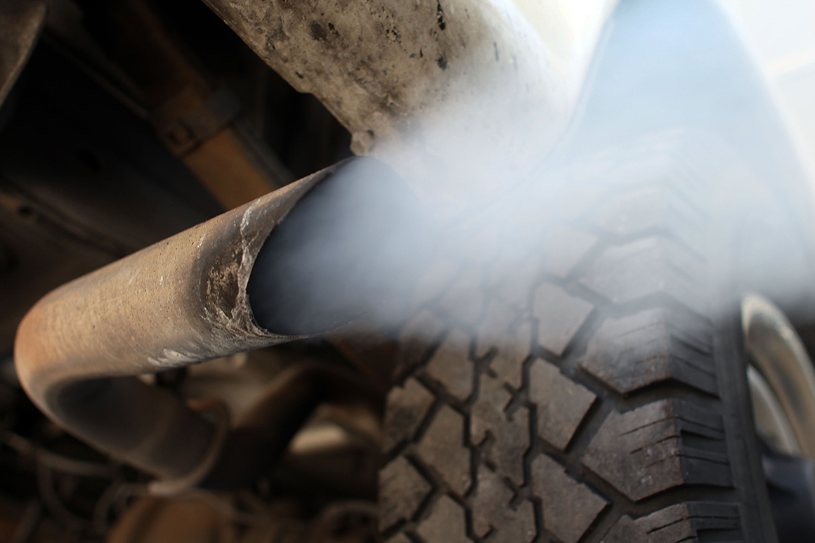 Exhaust flows out of the tailpipe of a vehicle Exhaust flows out of the tailpipe of a vehicle