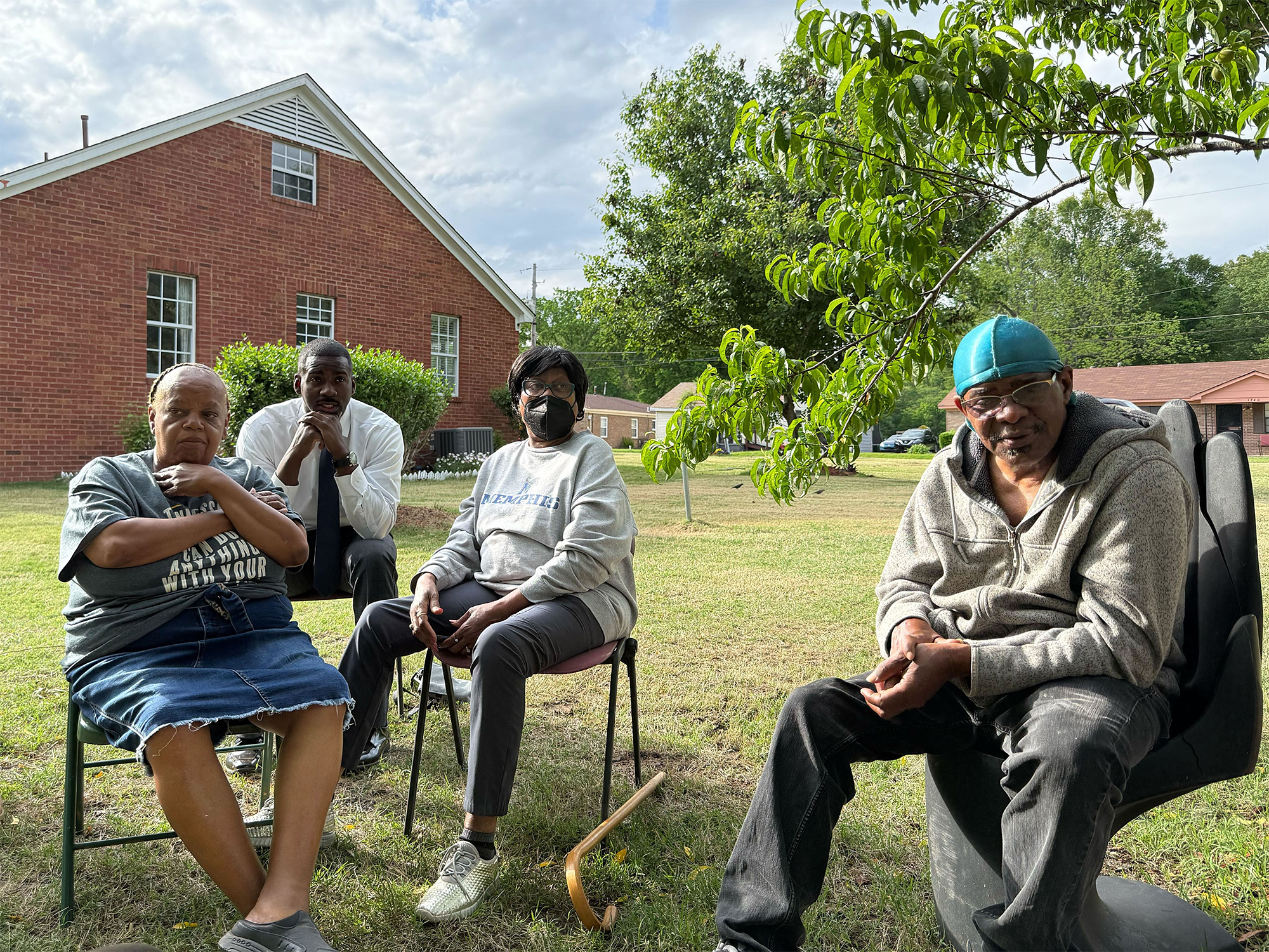 Easter May Knox (center) sits with her Boxtown neighbors discussing the pollution that wafts over their neighborhood from a nearby industrial park.