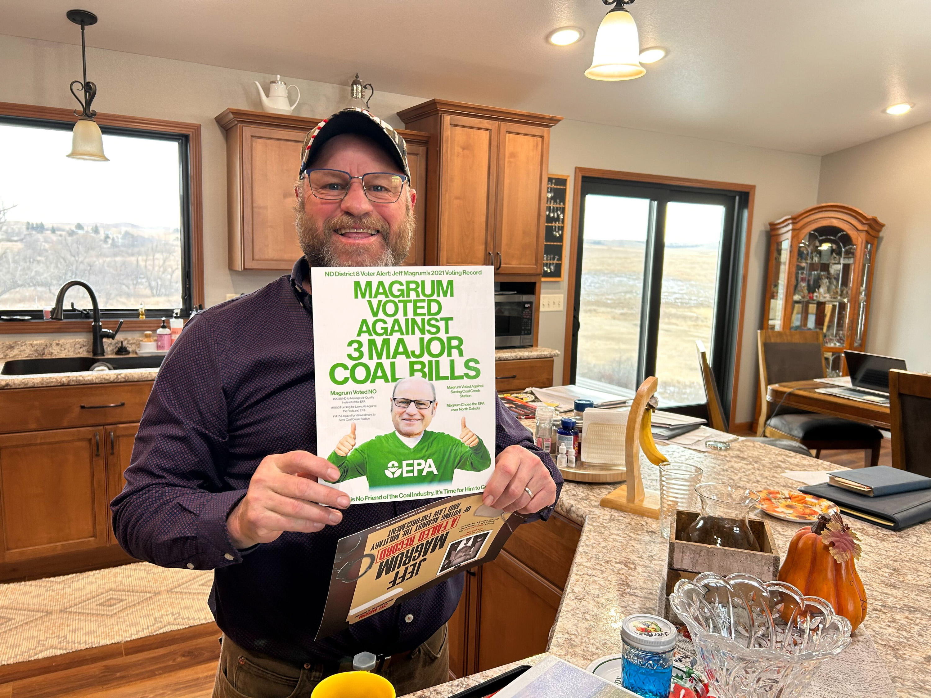 Jeff Magrum holds up mailers. Jeff Magrum holds up mailers.