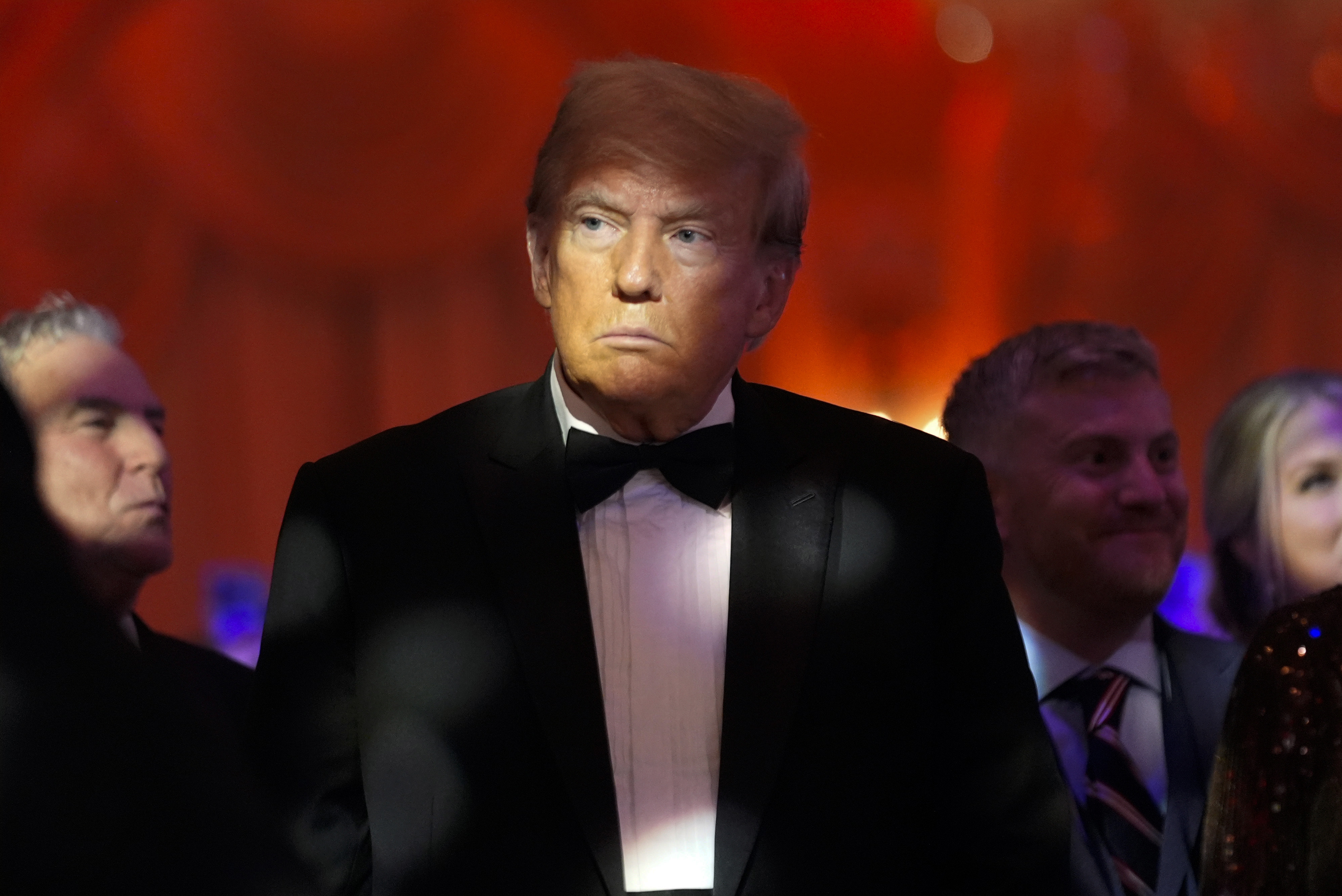 Donald Trump sits among crowd. Donald Trump sits among crowd.